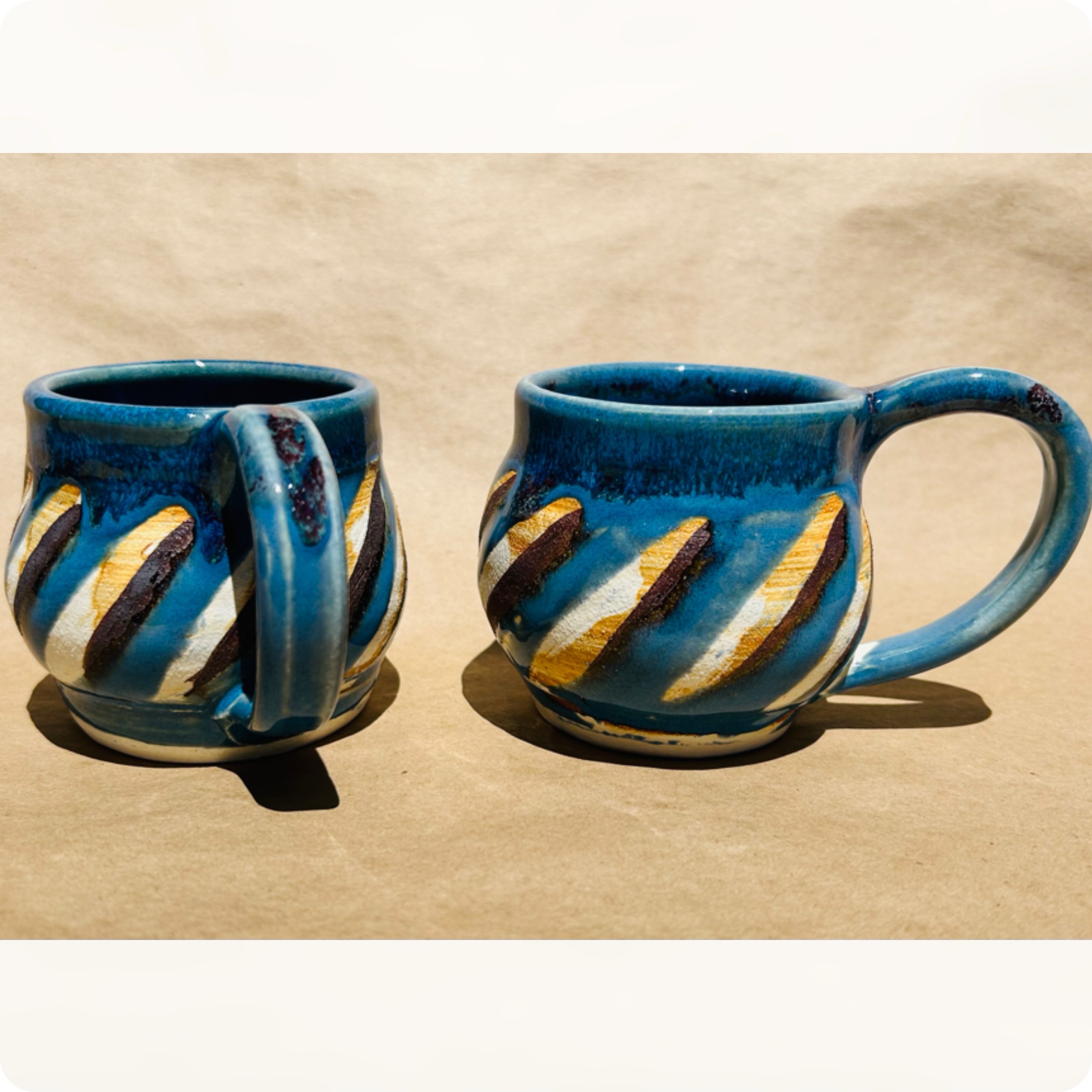 Round and blue thrown mugs