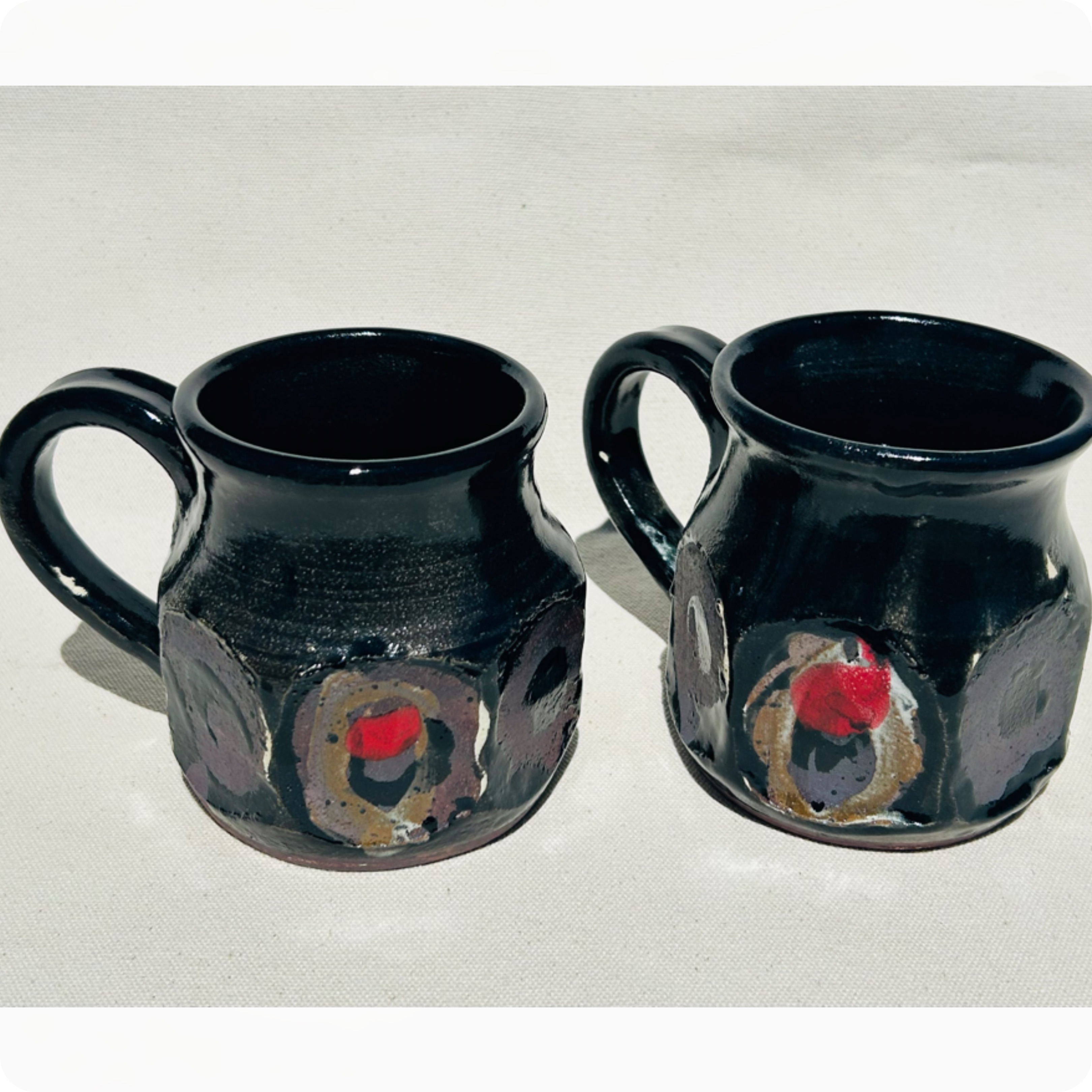 Faceted black mugs